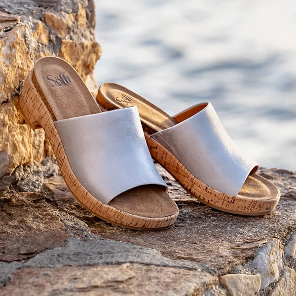 Featuring Cass slide sandal in silver metallic. Shop Cass.